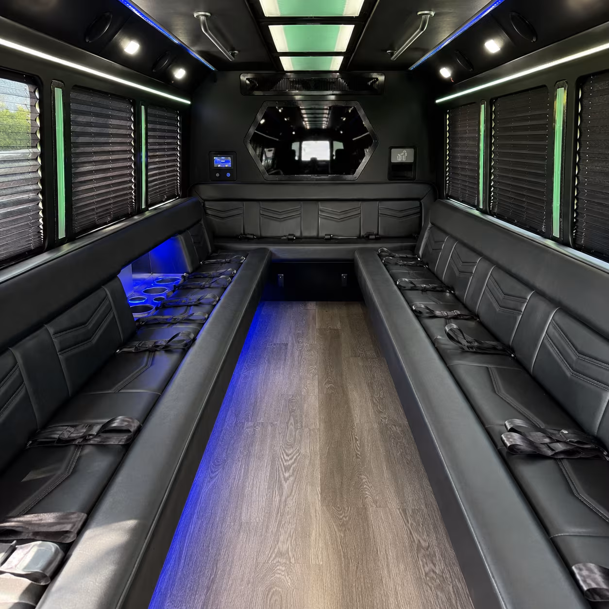 Wedding guests seated inside a party bus serving Palm Bay